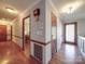 Bright hallway with hardwood floors and access to other rooms at 7169 Pleasant Grove Rd, Charlotte, NC 28216