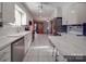 Updated kitchen with stainless steel appliances and white cabinetry at 7169 Pleasant Grove Rd, Charlotte, NC 28216