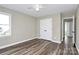 Well-lit bedroom with double doors and hardwood floors at 1061 Fairway Ridge Rd, Concord, NC 28027