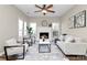 Living room features a fireplace and lots of natural light at 1061 Fairway Ridge Rd, Concord, NC 28027