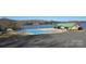 Community pool with lake view and covered seating at 107 Skyland Dr, Mount Gilead, NC 27306