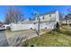 Home with driveway, basketball court, and fenced backyard at 11231 Heritage Green Dr, Cornelius, NC 28031