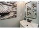 Modern bathroom with a floating sink and stylish wall art at 11231 Heritage Green Dr, Cornelius, NC 28031