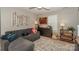 Cozy bedroom with a comfortable couch and a window at 11231 Heritage Green Dr, Cornelius, NC 28031
