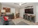Cozy bedroom with a comfortable couch, media console, and plenty of storage at 11231 Heritage Green Dr, Cornelius, NC 28031