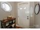 Bright entryway with decorative accents and a white door at 11231 Heritage Green Dr, Cornelius, NC 28031