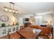 Open concept living area with a dining table and comfortable seating at 11231 Heritage Green Dr, Cornelius, NC 28031