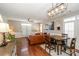 Spacious living room with leather couch and hardwood floors, featuring french doors at 11231 Heritage Green Dr, Cornelius, NC 28031