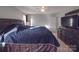 Spacious primary bedroom with ample natural light and a large dresser at 114 W Lee Ave, Bessemer City, NC 28016