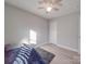 Bedroom featuring a ceiling fan and a large window at 114 W Lee Ave, Bessemer City, NC 28016