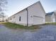 White detached garage with gravel driveway at 114 W Lee Ave, Bessemer City, NC 28016