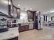 Modern kitchen with stainless steel appliances and white quartz countertops at 114 W Lee Ave, Bessemer City, NC 28016