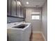 Bright laundry room with a Samsung washer and dryer at 114 W Lee Ave, Bessemer City, NC 28016