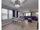 Open concept living area with kitchen view, breakfast bar, and hardwood floors at 114 W Lee Ave, Bessemer City, NC 28016