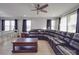 Living room with sectional sofa, coffee table, and hardwood floors at 114 W Lee Ave, Bessemer City, NC 28016