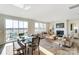 Open concept dining area with adjacent living room and kitchen at 1443 Honey Trl, Monroe, NC 28112