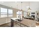 Kitchen island with granite countertop and stainless steel sink at 1467 Honey Trl, Monroe, NC 28112