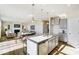 Open concept kitchen with island and view into living room at 1467 Honey Trl, Monroe, NC 28112