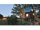 Charming treehouse with lights on at dusk at 1467 Honey Trl, Monroe, NC 28112