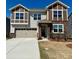 Charming two-story home featuring a stone and siding facade, a two-car garage, and a well-maintained front yard at 1467 Honey Trl, Monroe, NC 28112