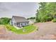 Expansive backyard showcasing a patio, grill, mature trees, and lush green lawn, ideal for outdoor activities at 15298 Windward Ln, Lancaster, SC 29720