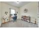 Inviting bedroom featuring a desk setup, comfortable chair, and display shelving at 15298 Windward Ln, Lancaster, SC 29720