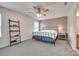 Cozy bedroom featuring a comfortable bed, ceiling fan and soft, neutral color palette at 15298 Windward Ln, Lancaster, SC 29720