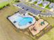 Aerial view of community pool and playground, offering residents recreational amenities and a place to socialize at 15298 Windward Ln, Lancaster, SC 29720