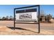 Sign announcing the opening of a new village center at 15298 Windward Ln, Lancaster, SC 29720