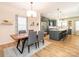 Bright dining room with hardwood floors and modern light fixture at 15298 Windward Ln, Lancaster, SC 29720