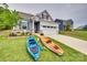 Charming home with a well-manicured lawn, landscaping, and two kayaks, offering outdoor recreation opportunities at 15298 Windward Ln, Lancaster, SC 29720