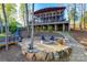 Backyard fire pit and outdoor seating area, complemented by a custom-built elevated screened porch at 15298 Windward Ln, Lancaster, SC 29720