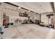 Spacious garage with overhead storage, bikes, and lawn equipment, providing ample space for vehicles and organization at 15298 Windward Ln, Lancaster, SC 29720