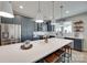 Modern kitchen featuring a large island with seating, stainless steel appliances, and ample cabinet space at 15298 Windward Ln, Lancaster, SC 29720