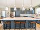 Spacious kitchen island with seating, gray cabinets, white countertops, and stainless steel appliances at 15298 Windward Ln, Lancaster, SC 29720