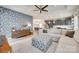 Inviting living room with stylish furniture, open to the kitchen and dining area at 15298 Windward Ln, Lancaster, SC 29720