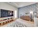 Cozy living room with decorative wallpaper and view into the kitchen and dining area at 15298 Windward Ln, Lancaster, SC 29720