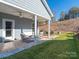 Relaxing covered patio with outdoor seating and ceiling fans at 15298 Windward Ln, Lancaster, SC 29720
