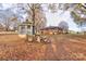 Backyard with gazebo, stone bench and autumn leaves at 1602 Eaves Rd, Shelby, NC 28152