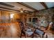 Stone fireplace and wood paneled walls in dining area at 1602 Eaves Rd, Shelby, NC 28152