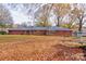 Brick ranch house with large backyard and autumn leaves at 1602 Eaves Rd, Shelby, NC 28152