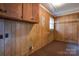 Laundry area with wooden cabinets and shelving at 1602 Eaves Rd, Shelby, NC 28152