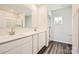 Double vanity bathroom with white cabinets and a large mirror at 1615 Cannonball Ln, Bessemer City, NC 28016