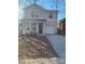 Two-story house with gray siding, white trim, and a double-car garage at 1827 Mcdonald St, Charlotte, NC 28216