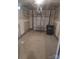 Attached garage with concrete flooring and an overhead door at 1827 Mcdonald St, Charlotte, NC 28216