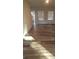 Bright living room with hardwood floors and sunlight streaming through the windows at 1827 Mcdonald St, Charlotte, NC 28216