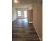 Spacious living area with hardwood floors and an open floor plan at 1827 Mcdonald St, Charlotte, NC 28216