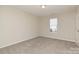 Simple bedroom with neutral walls and carpet at 1828 Sugar Hollow Dr, Charlotte, NC 28214