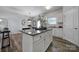 Eat-in kitchen with island, granite countertops, and white cabinets at 193 Audra Faye Ln, Indian Trail, NC 28079