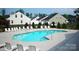 Community pool with plenty of lounge chairs for relaxation at 2029 Shady Pond Dr, Clover, SC 29710